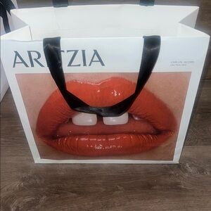 Aritzia Bag with Bold Red Lip Design